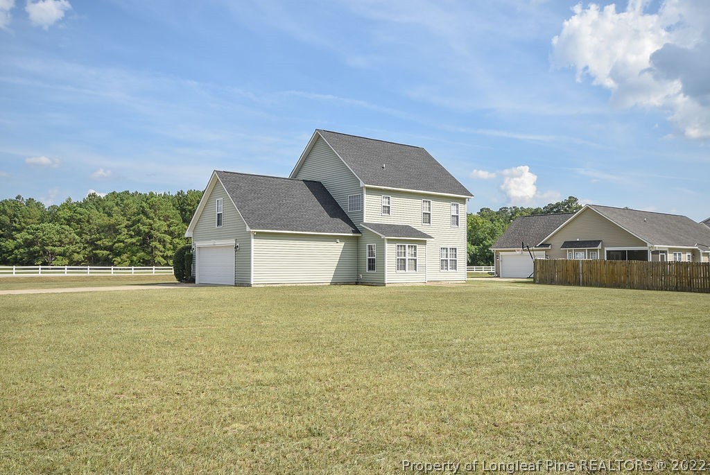 6700 Valley Falls Road Hope Mills, NC 28348 - Photo 42 of 48 a front view of a house with a yard