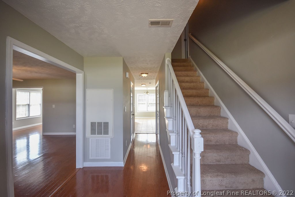 6700 Valley Falls Road Hope Mills, NC 28348 - Photo 5 of 48 a view of entryway and hall with wooden floor