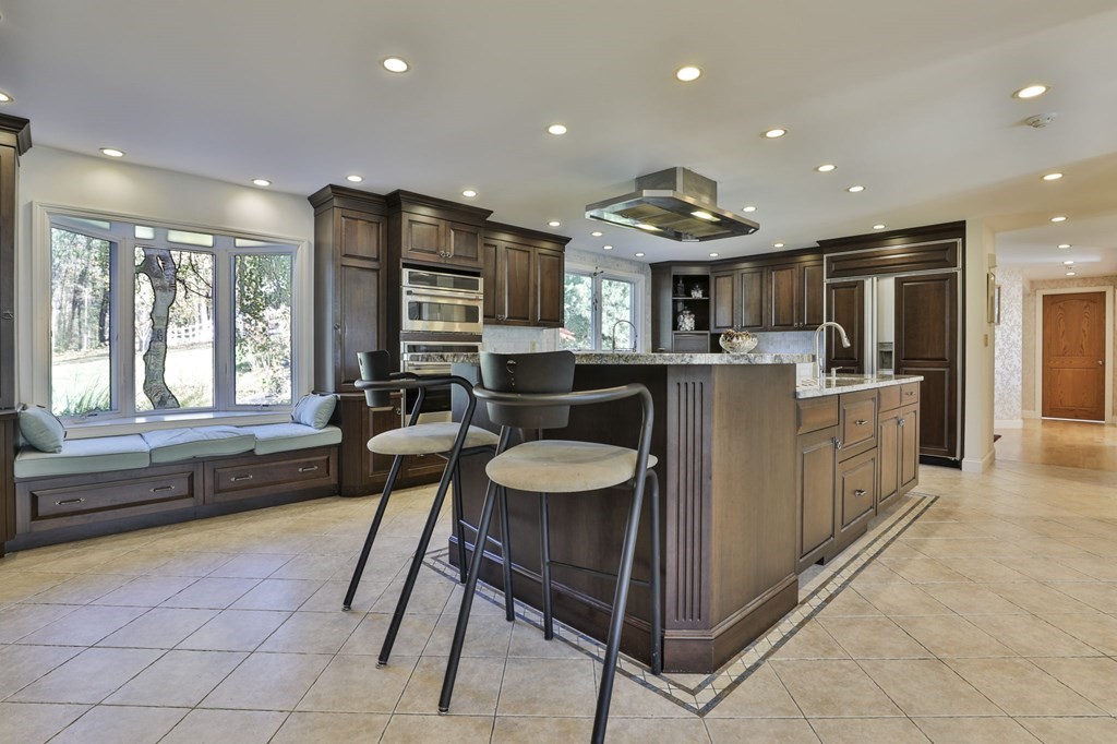 13 Haskell Lane Harvard, MA 01451 - Photo 12 of 39 a dining hall with stainless steel appliances granite countertop a couch and a view of living room