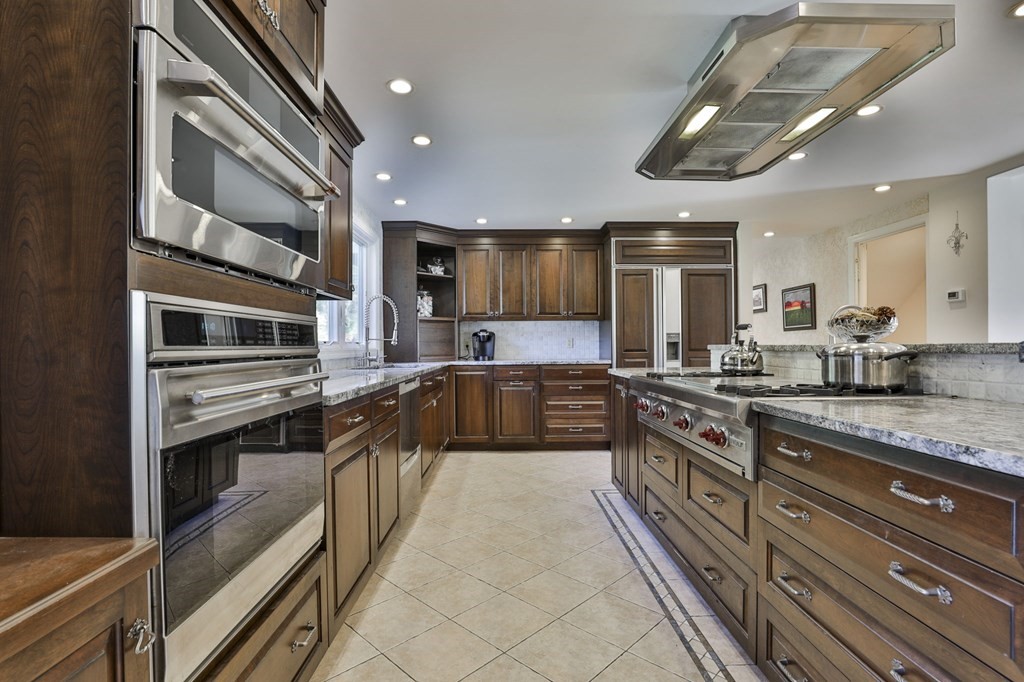 13 Haskell Lane Harvard, MA 01451 - Photo 14 of 39 a large kitchen with stainless steel appliances granite countertop a large stove a sink and dishwasher