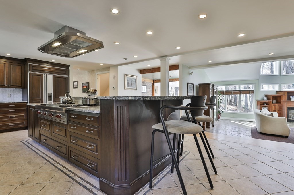 13 Haskell Lane Harvard, MA 01451 - Photo 15 of 39 a kitchen with stainless steel appliances kitchen island granite countertop a stove and cabinets