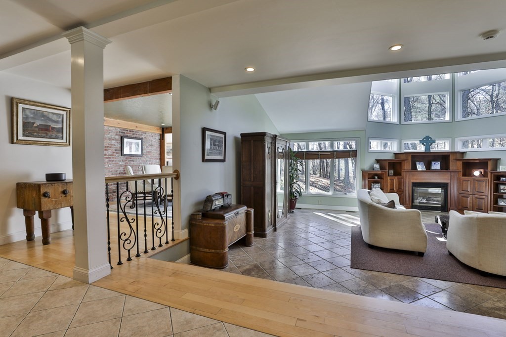 13 Haskell Lane Harvard, MA 01451 - Photo 16 of 39 a living room with furniture and a book shelf