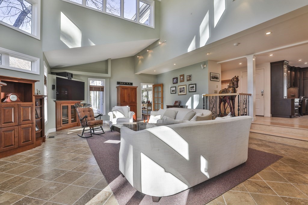 13 Haskell Lane Harvard, MA 01451 - Photo 19 of 39 a living room with furniture and a dining table with wooden floor