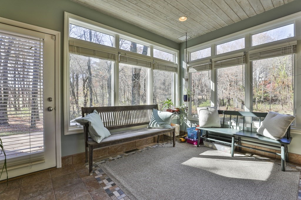 13 Haskell Lane Harvard, MA 01451 - Photo 22 of 39 a living room with furniture and floor to ceiling windows