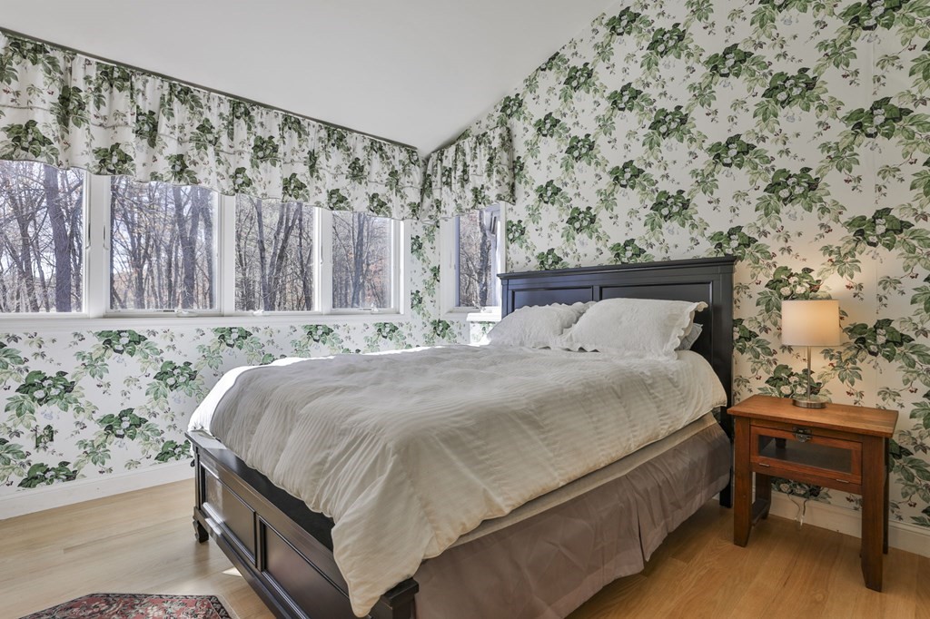 13 Haskell Lane Harvard, MA 01451 - Photo 29 of 39 a bedroom with a bed and a chair
