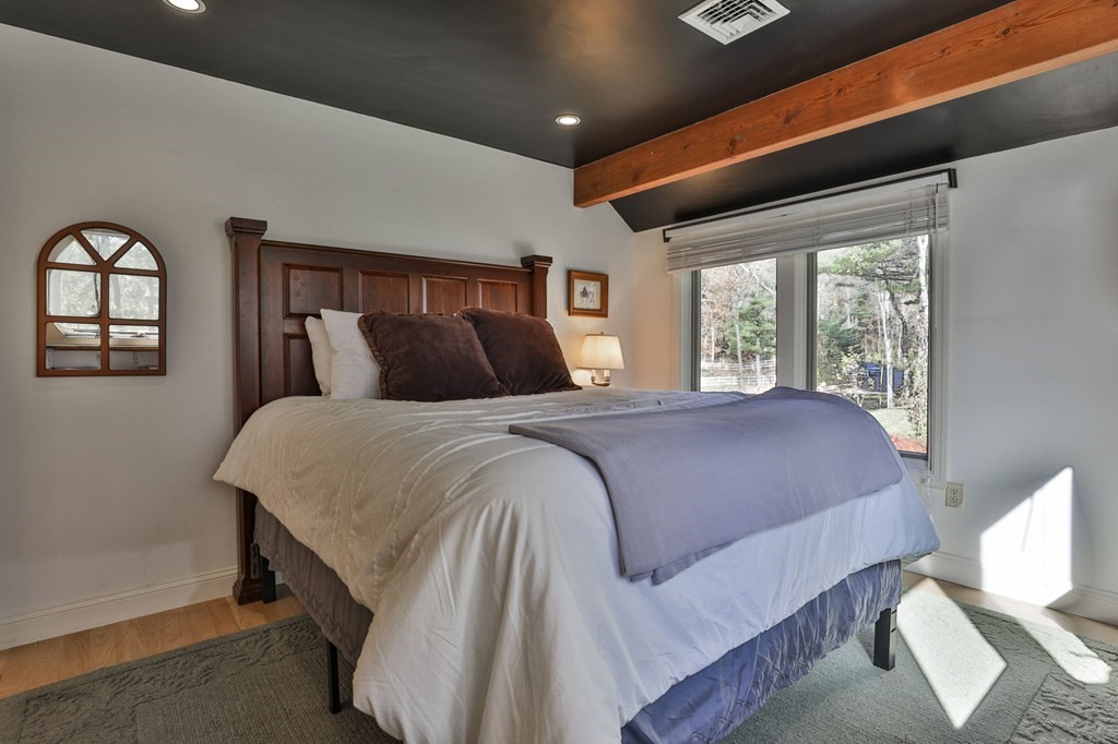 13 Haskell Lane Harvard, MA 01451 - Photo 31 of 39 a bedroom with a large bed and a window