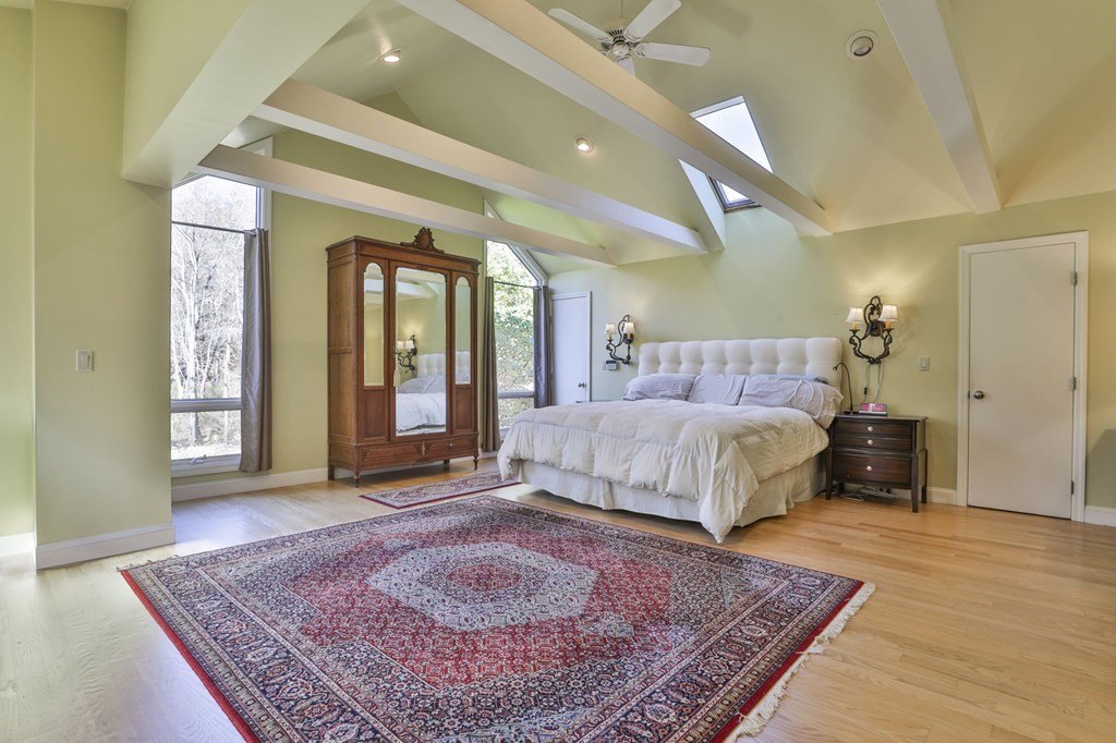 13 Haskell Lane Harvard, MA 01451 - Photo 33 of 39 a bed sitting in a spacious bedroom next to a window