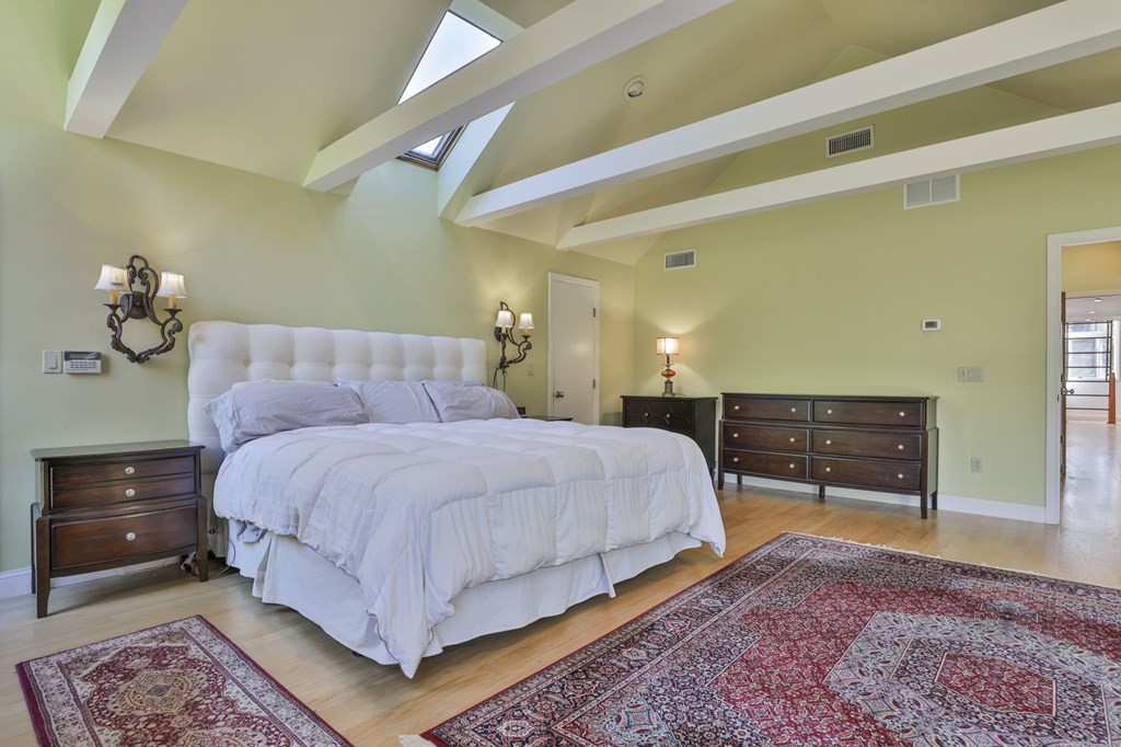 13 Haskell Lane Harvard, MA 01451 - Photo 34 of 39 a spacious bedroom with a bed and a lamp