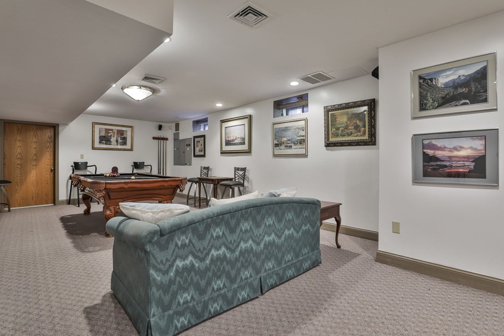 13 Haskell Lane Harvard, MA 01451 - Photo 36 of 39 a living room with furniture and painting on the wall