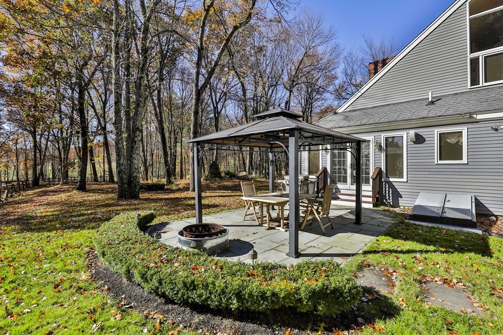 13 Haskell Lane Harvard, MA 01451 - Photo 7 of 39 a view of a house with backyard and sitting area