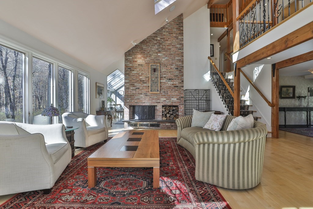13 Haskell Lane Harvard, MA 01451 - Photo 9 of 39 a living room with furniture and a fireplace