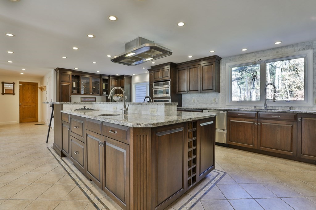 13 Haskell Lane Harvard, MA 01451 - Photo 10 of 39 a kitchen with stainless steel appliances granite countertop wooden cabinets a sink and a stove