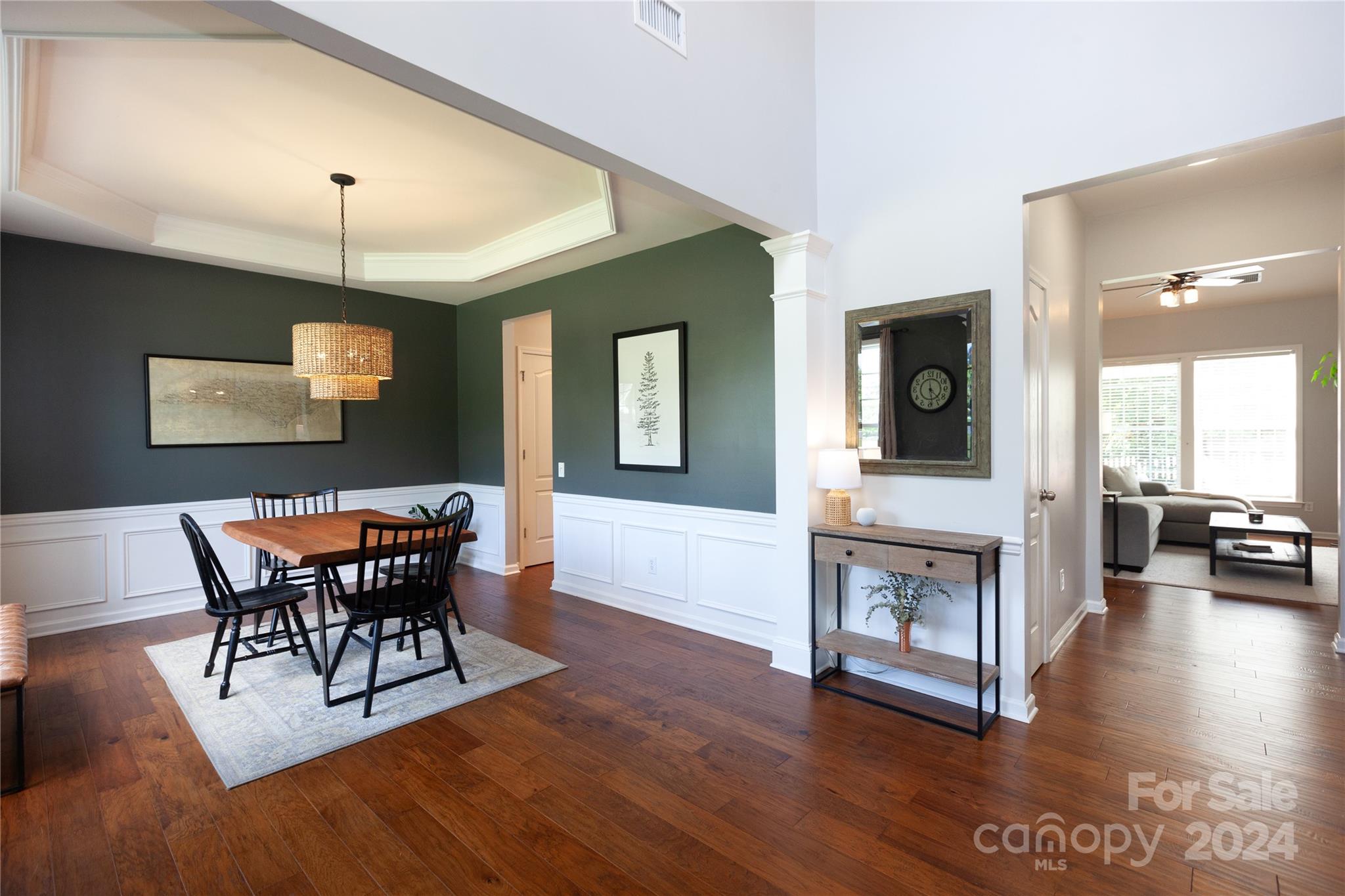 2304 Coltsgate Road Waxhaw, NC 28173 - Photo 2 of 29 a view of a dining room with furniture and wooden floor