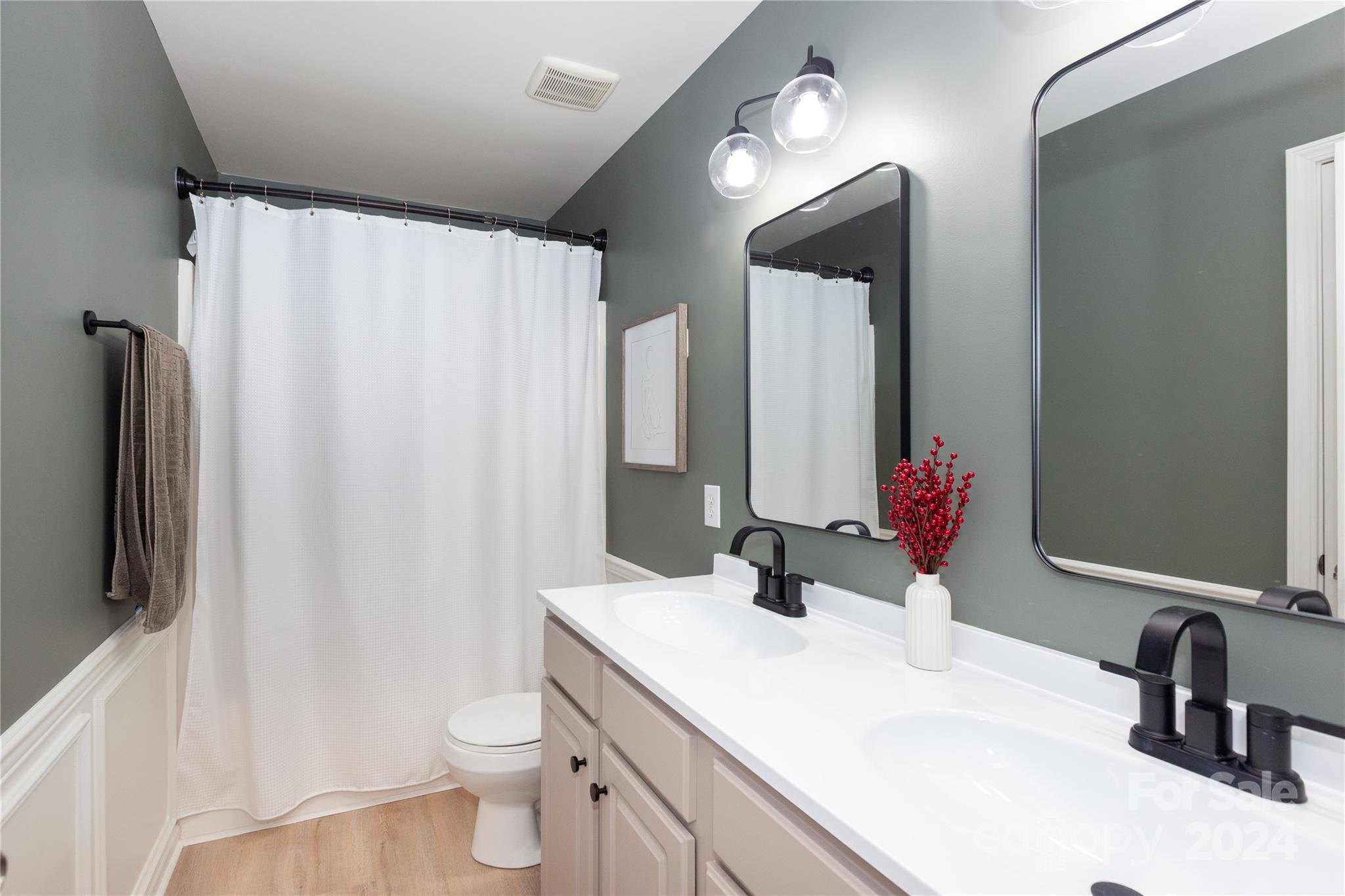 2304 Coltsgate Road Waxhaw, NC 28173 - Photo 21 of 29 a bathroom with a double vanity sink mirror and toilet