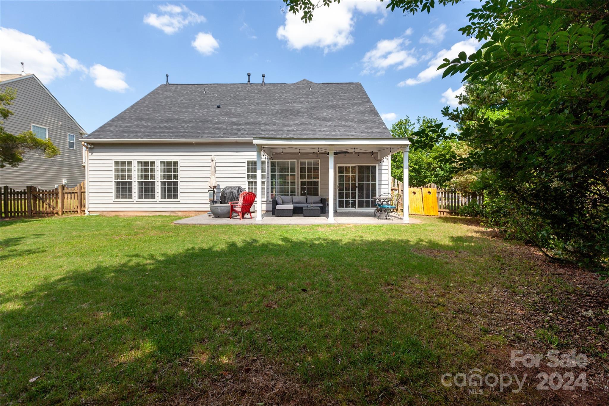 2304 Coltsgate Road Waxhaw, NC 28173 - Photo 26 of 29 a front view of a house with a yard and trees