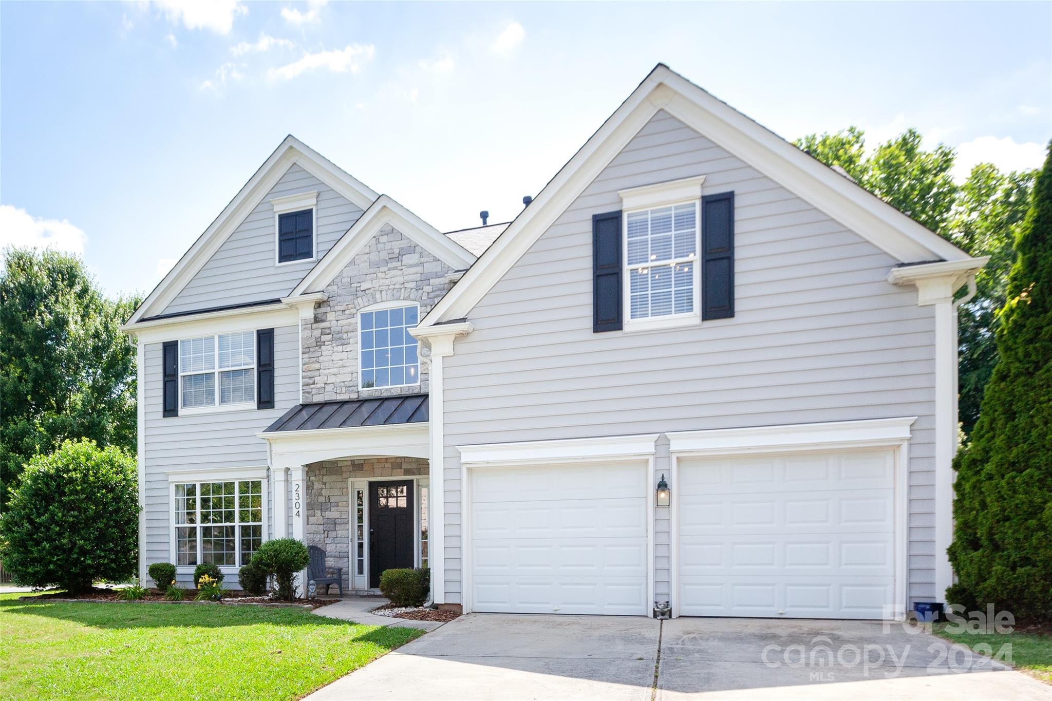 2304 Coltsgate Road Waxhaw, NC 28173 - Photo 28 of 29 a view of a yard in front view of a house