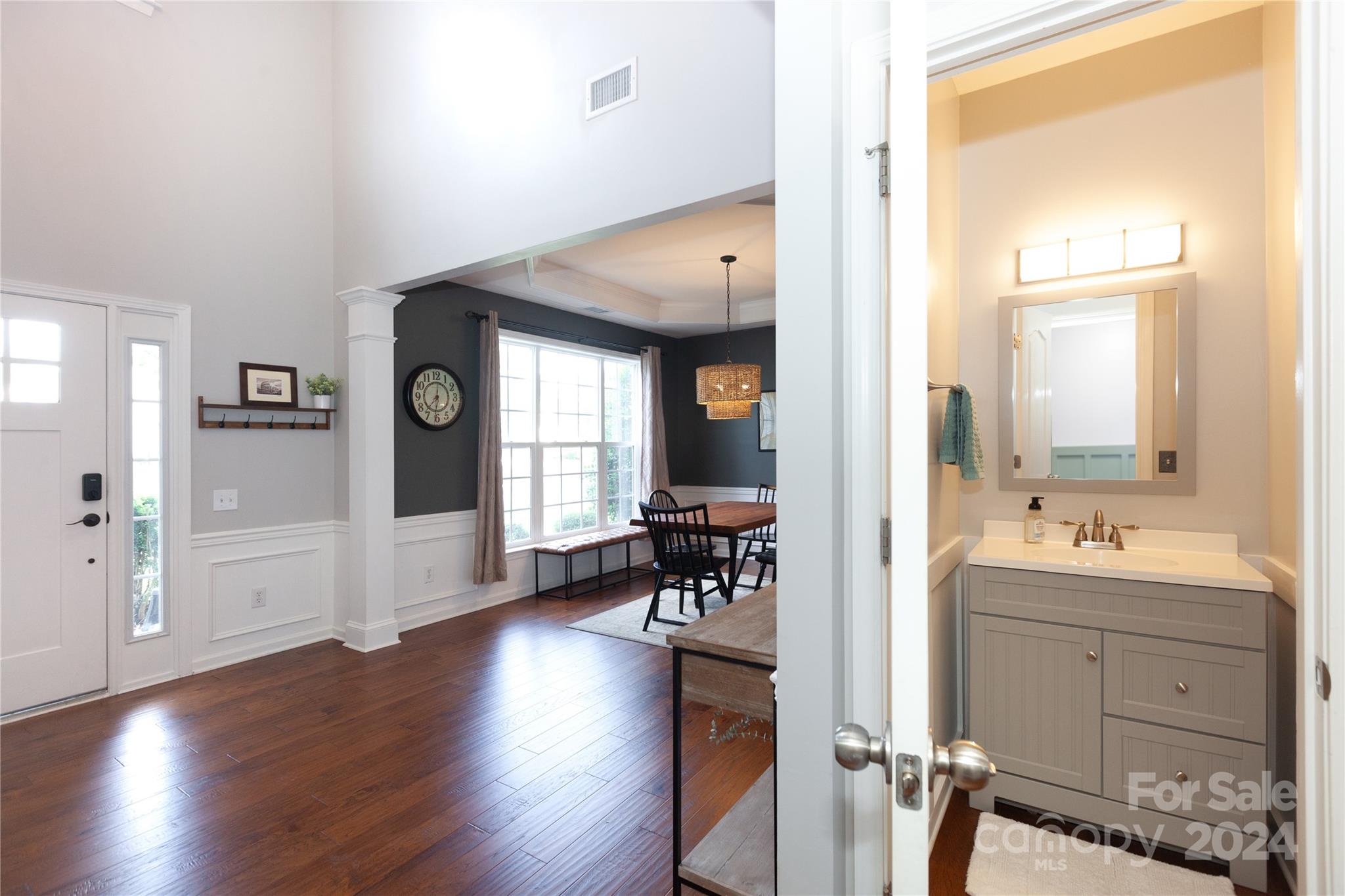 2304 Coltsgate Road Waxhaw, NC 28173 - Photo 5 of 29 a view of a livingroom with wooden floor and furniture