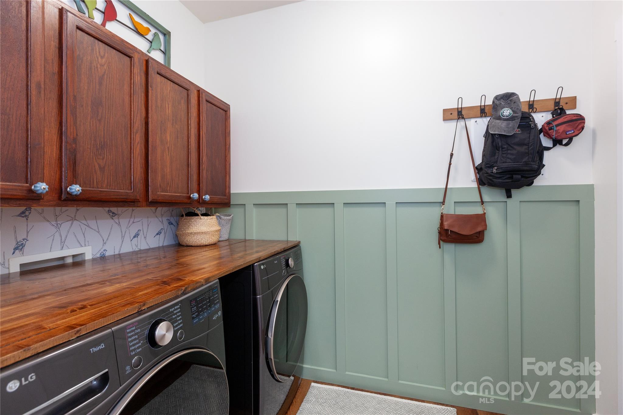 2304 Coltsgate Road Waxhaw, NC 28173 - Photo 6 of 29 a view of storage and utility room with racks on the wall