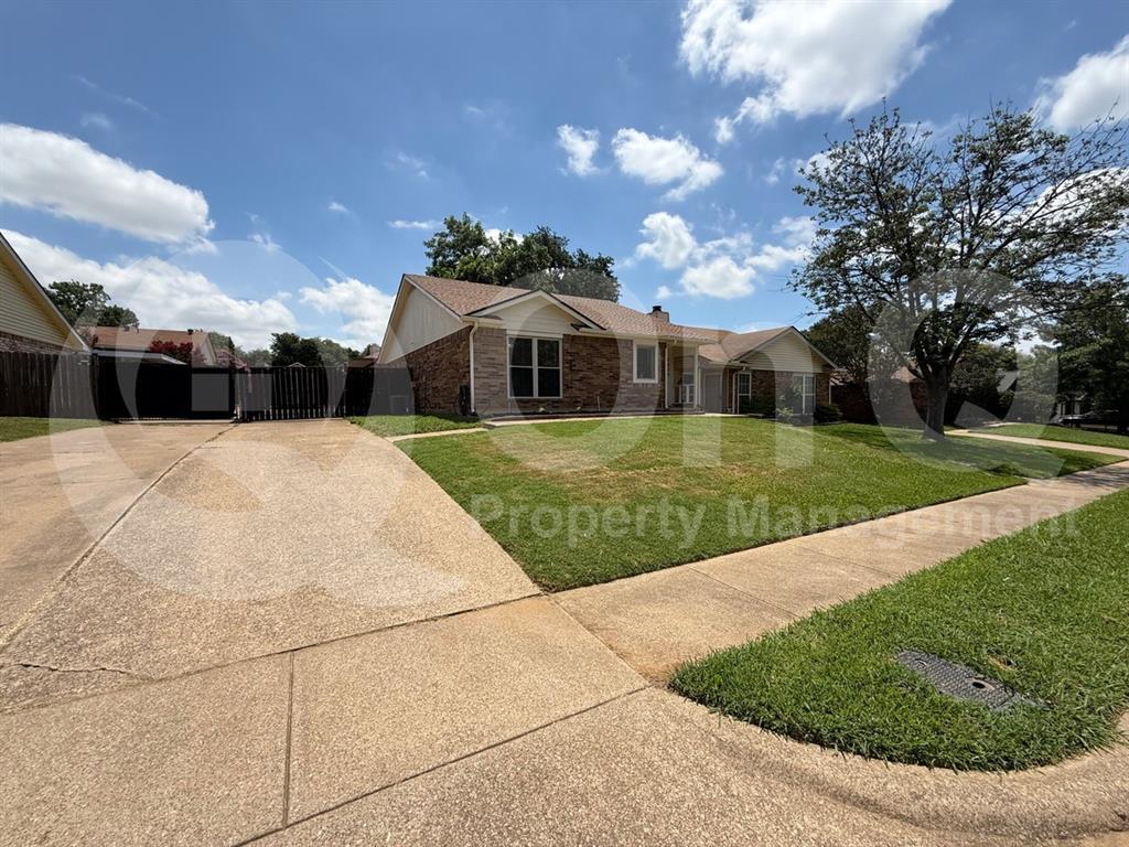 3000 Timothy Lane Euless, TX 76039 - Photo 16 of 19 Ranch-style exterior with a brick and siding facade, featuring a prominent front lawn and a concrete driveway
