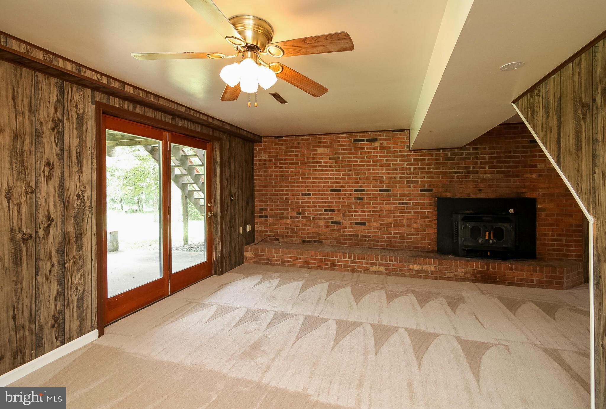 13088 Elk Ridge Road Fredericksburg, VA 22406 - Photo 14 of 30 Lower Level Family Room with Wood Stove