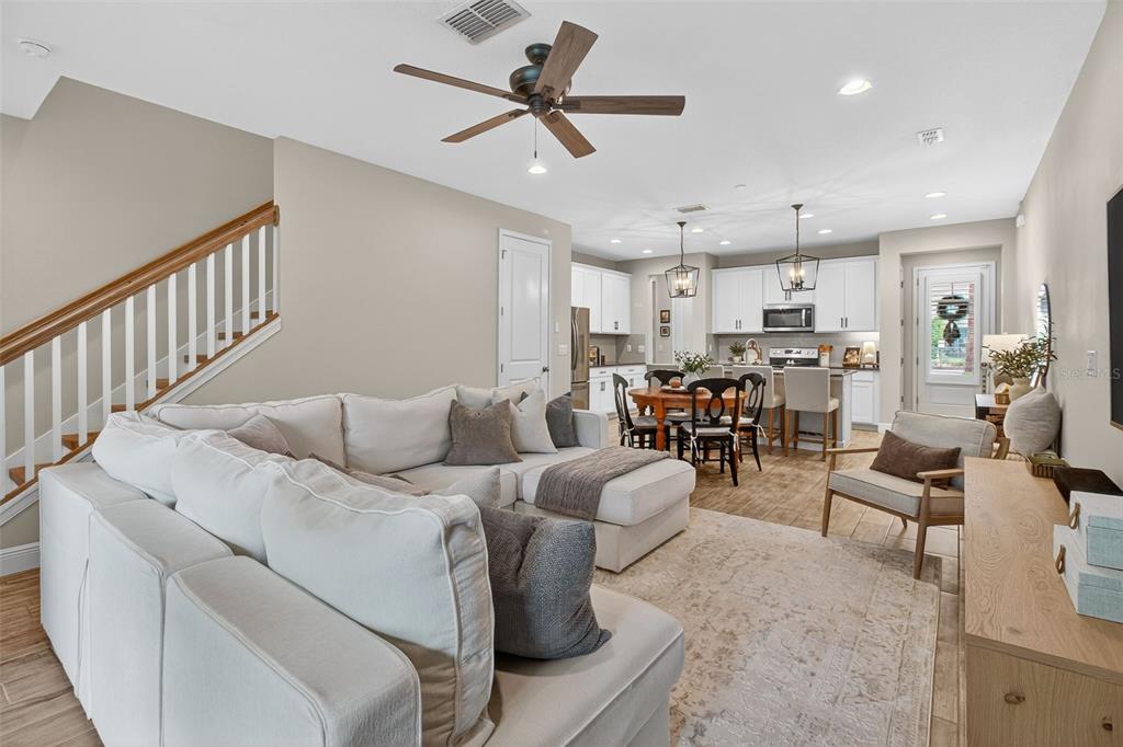 2007 Palm Key Avenue Oldsmar, FL 34677 - Photo 14 of 54 a living room with furniture kitchen view and a chandelier