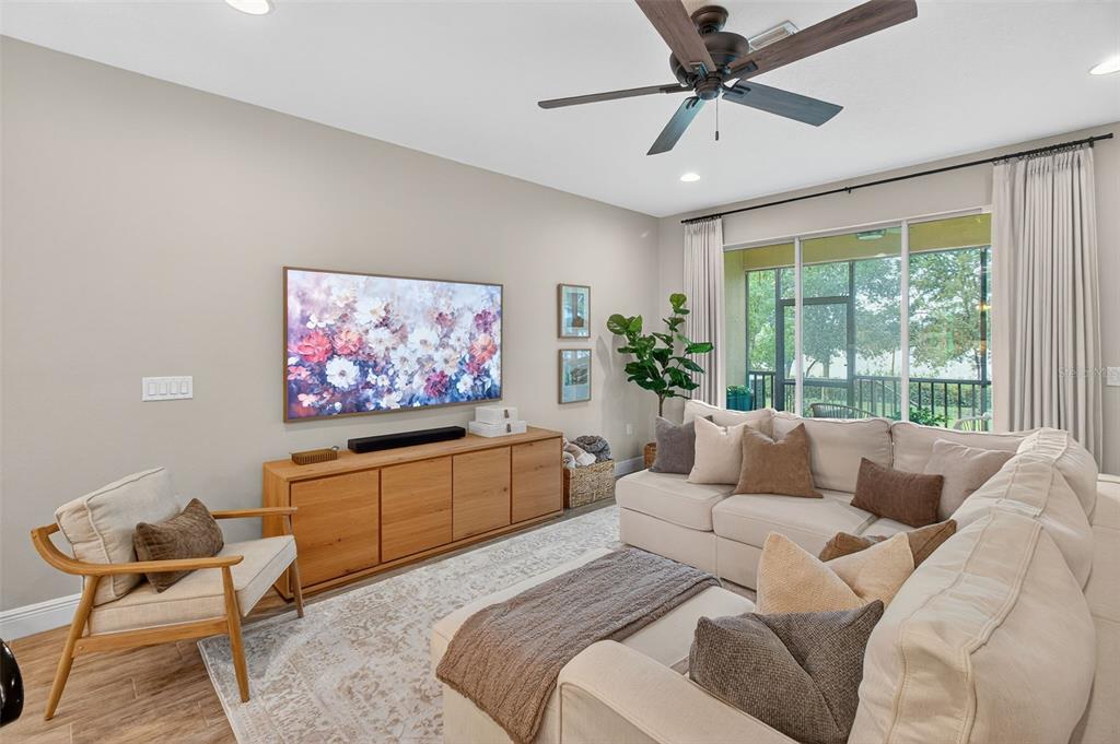 2007 Palm Key Avenue Oldsmar, FL 34677 - Photo 15 of 54 a living room with furniture a flat screen tv and a large window