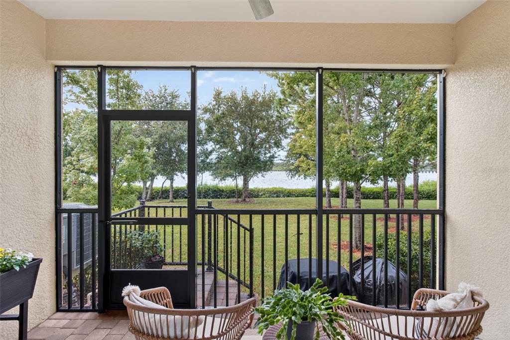 2007 Palm Key Avenue Oldsmar, FL 34677 - Photo 16 of 54 a view of a balcony with lake view and a floor to ceiling window