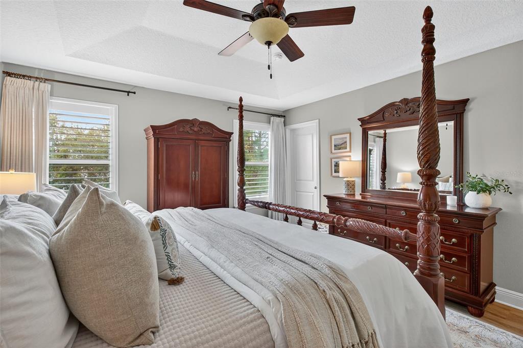 2007 Palm Key Avenue Oldsmar, FL 34677 - Photo 24 of 54 a bedroom with a bed a dresser and a chandelier