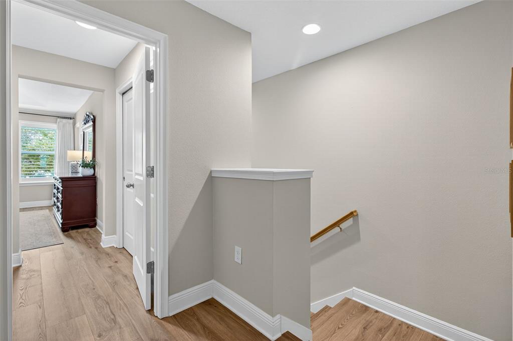 2007 Palm Key Avenue Oldsmar, FL 34677 - Photo 28 of 54 a view of a hallway with wooden floor