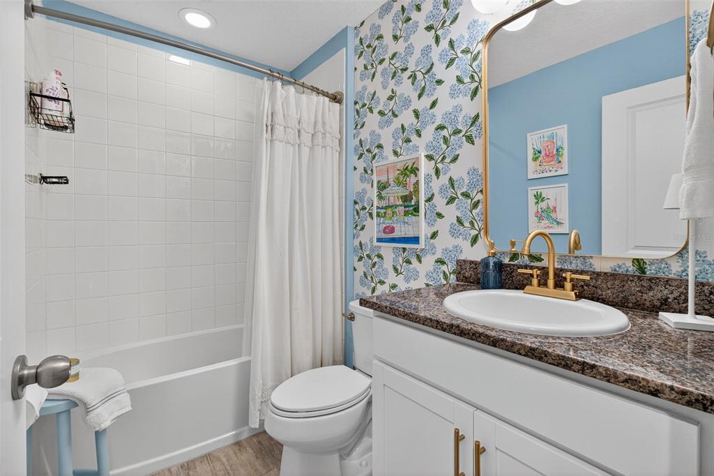 2007 Palm Key Avenue Oldsmar, FL 34677 - Photo 32 of 54 a bathroom with a granite countertop sink toilet and shower