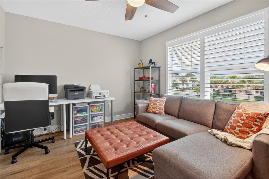 2007 Palm Key Avenue Oldsmar, FL 34677 - Photo 34 of 54 a living room with furniture and a flat screen tv