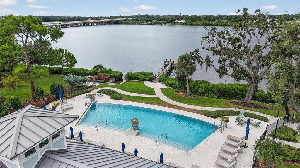2007 Palm Key Avenue Oldsmar, FL 34677 - Photo 41 of 54 a view of a lake with couches and wooden floor