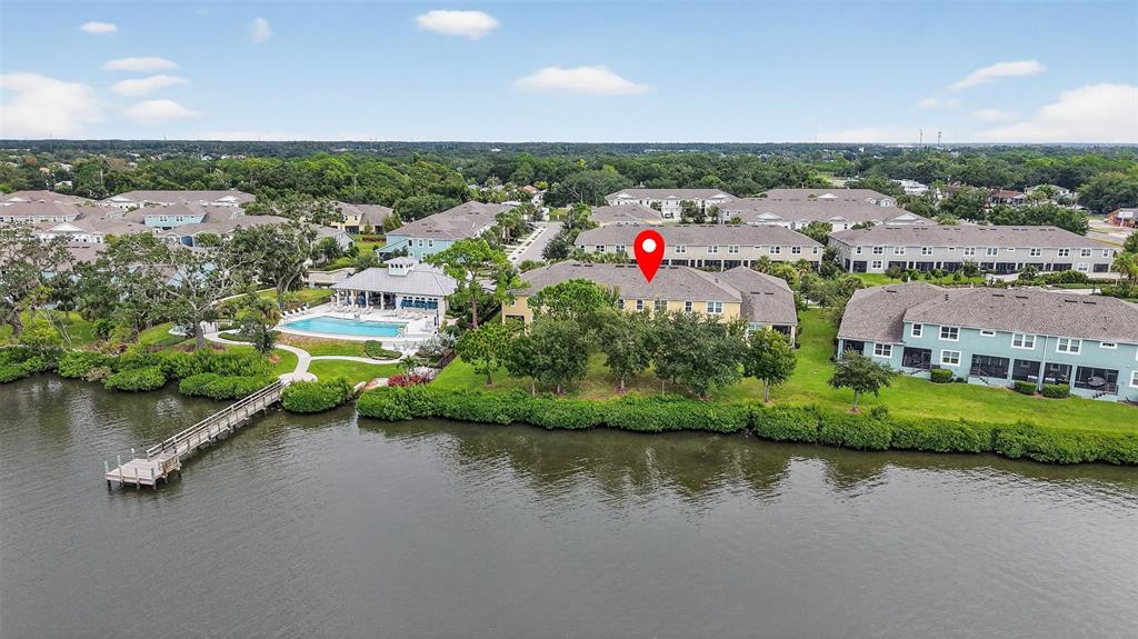 2007 Palm Key Avenue Oldsmar, FL 34677 - Photo 43 of 54 an aerial view of a house with a yard and lake view