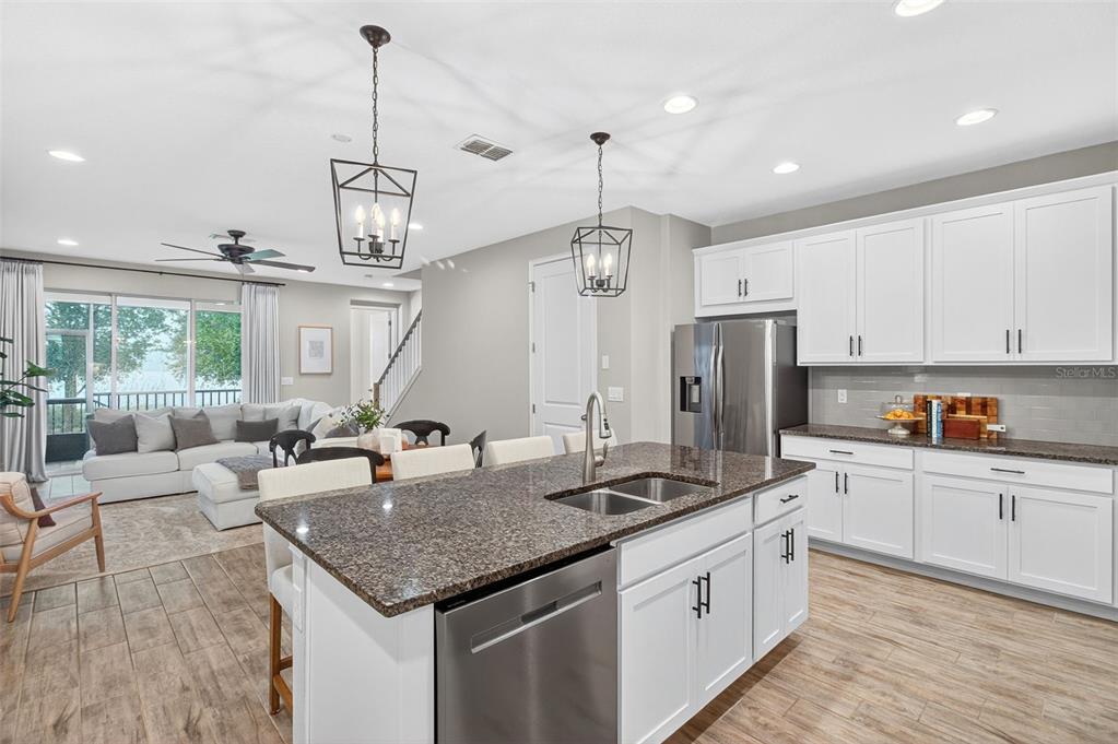2007 Palm Key Avenue Oldsmar, FL 34677 - Photo 7 of 54 a kitchen with stainless steel appliances granite countertop a sink stove and refrigerator