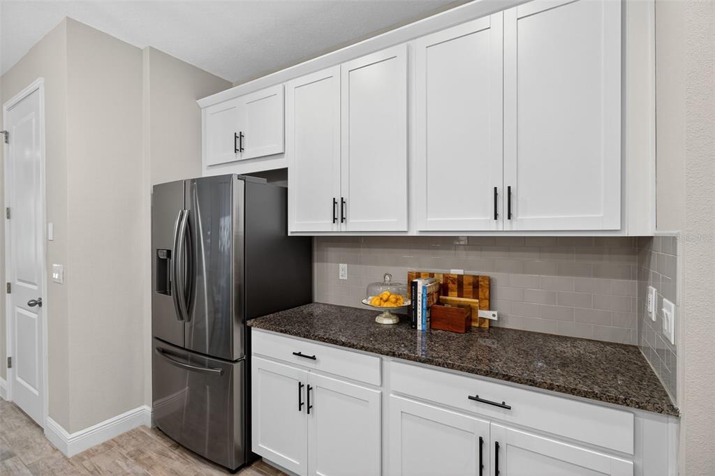 2007 Palm Key Avenue Oldsmar, FL 34677 - Photo 8 of 54 a kitchen with stainless steel appliances granite countertop white cabinets and a refrigerator