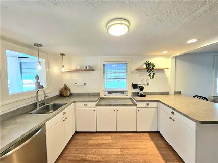 a kitchen with a sink and cabinets