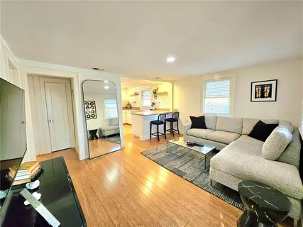 a living room with furniture and a table