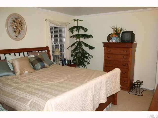 This generous master bedroom features crown molding and a walk-in closet. Master Bedroom