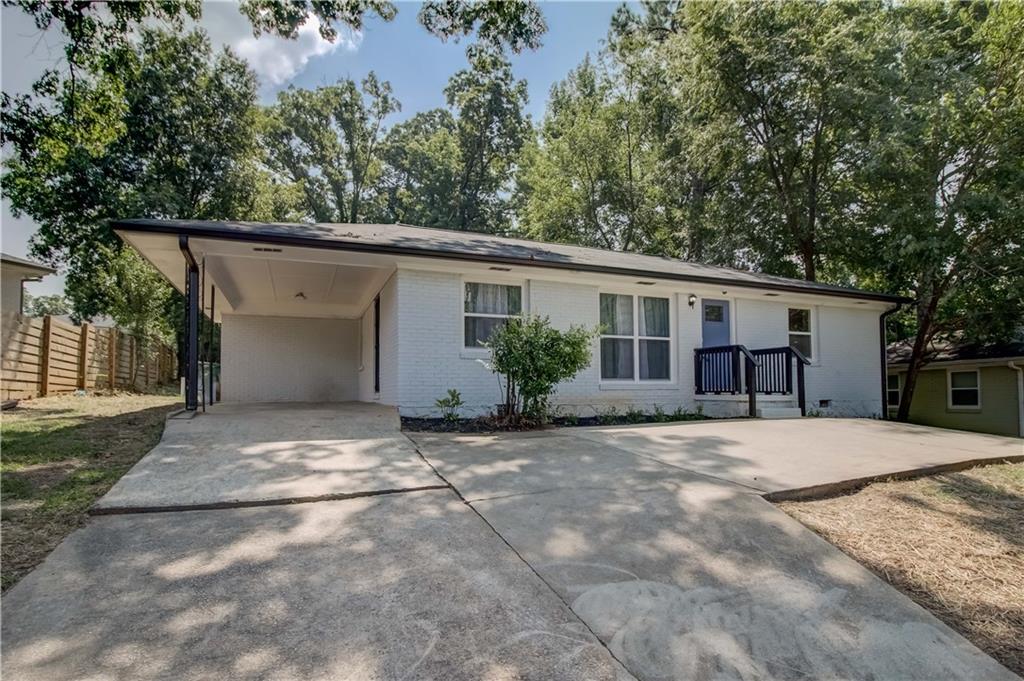2788 Gresham Rd S East Atlanta, GA 30316 - Photo 1 of 1 a view of a house with a backyard and a tree