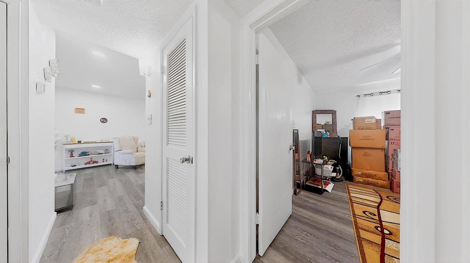 617 West Granger Avenue, Unit 66 Modesto, CA 95350 - Photo 23 of 46 a view of a bedroom from a hallway