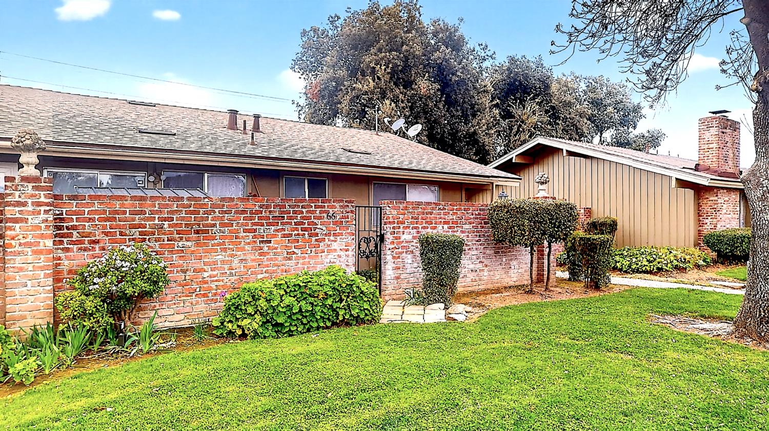 617 West Granger Avenue, Unit 66 Modesto, CA 95350 - Photo 25 of 46 a front view of a house with a yard