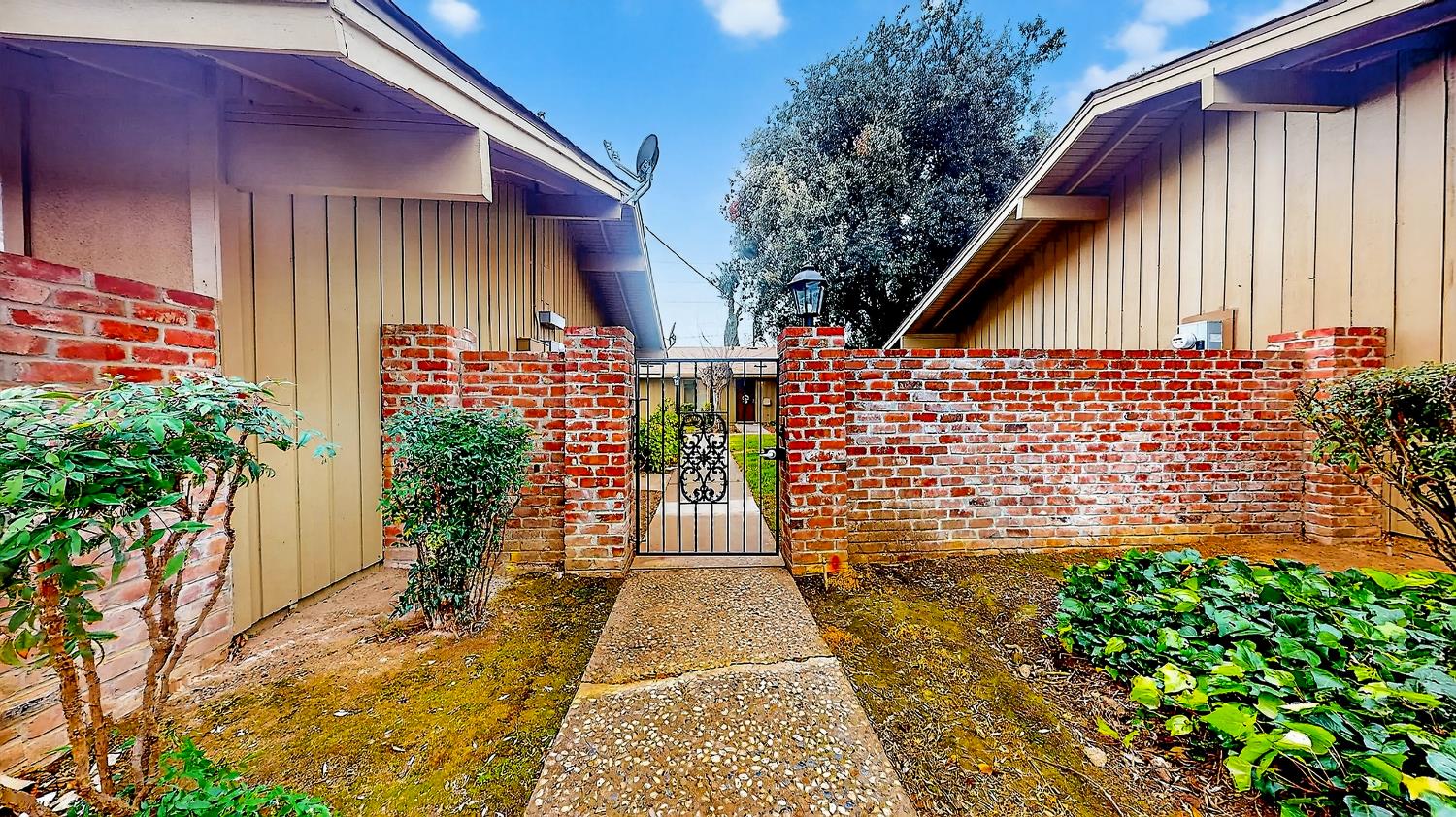 617 West Granger Avenue, Unit 66 Modesto, CA 95350 - Photo 3 of 46 a view of entryway with flower garden