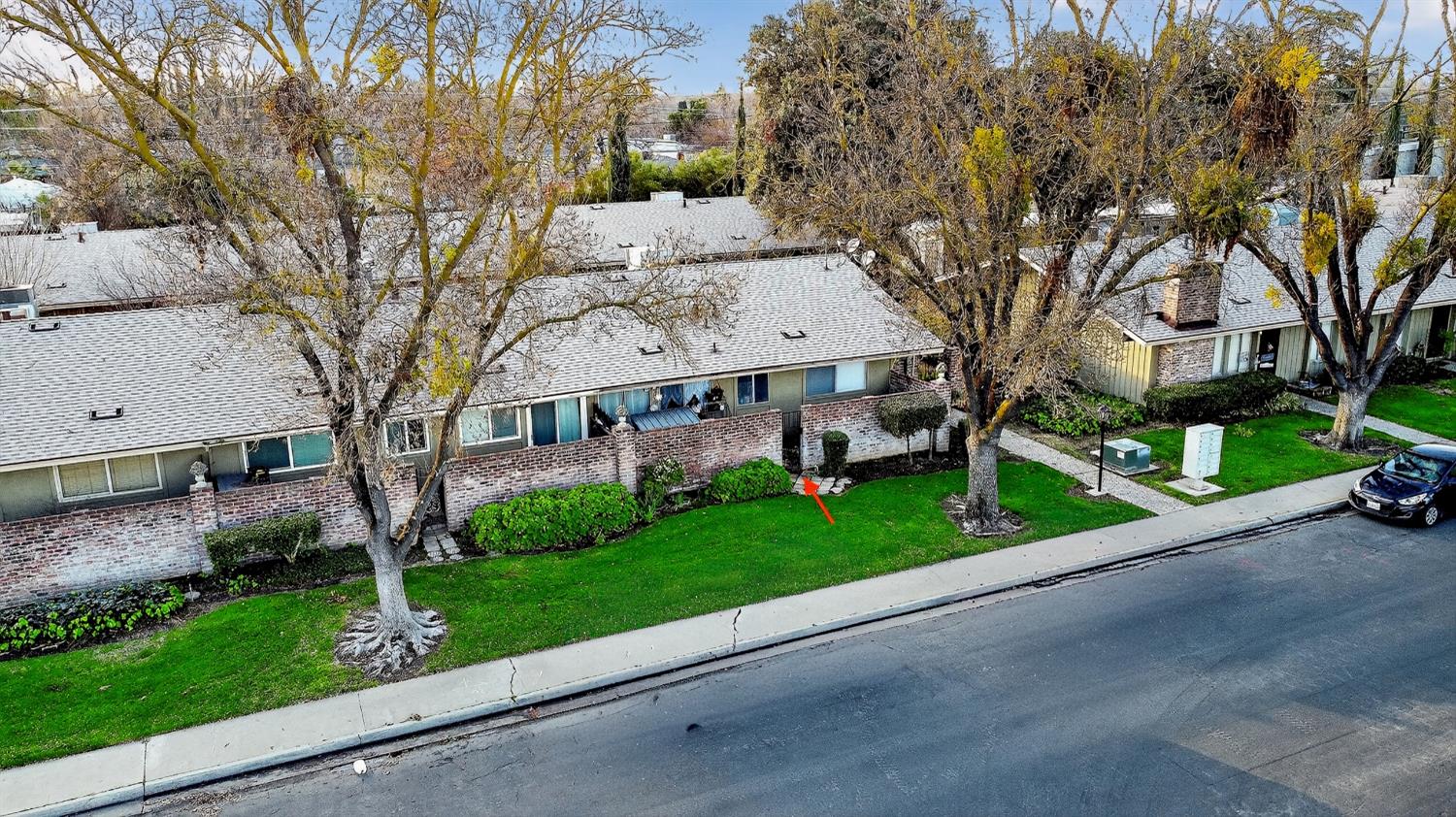 617 West Granger Avenue, Unit 66 Modesto, CA 95350 - Photo 43 of 46 a view of a house with a yard and large tree