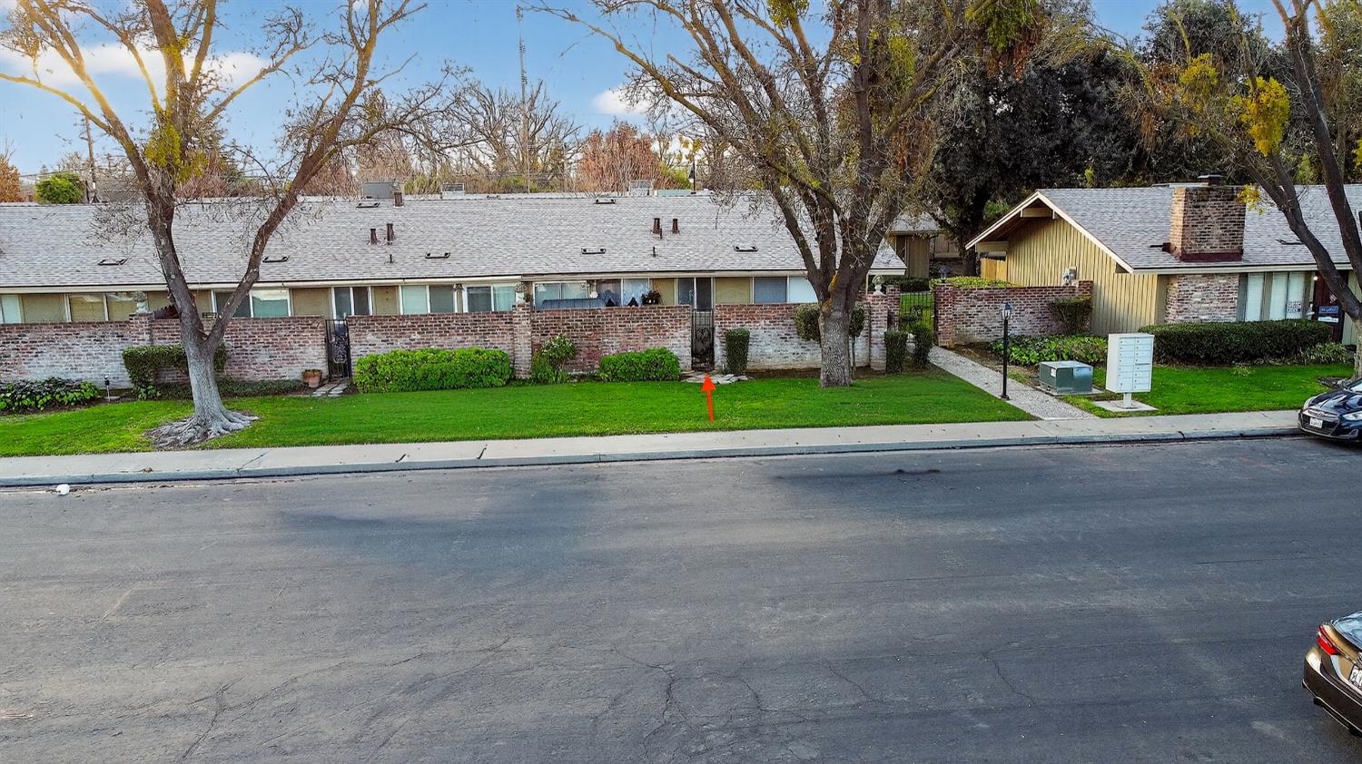 617 West Granger Avenue, Unit 66 Modesto, CA 95350 - Photo 44 of 46 a view of house with a yard and large trees