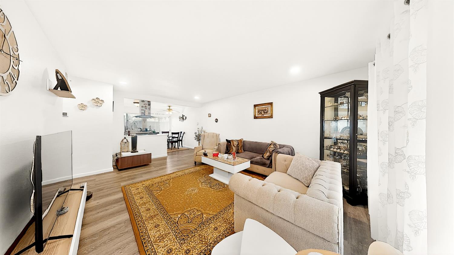 617 West Granger Avenue, Unit 66 Modesto, CA 95350 - Photo 5 of 46 a living room with furniture and a flat screen tv