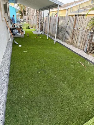 a view of a backyard with sitting area