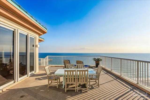 a view of a balcony with furniture