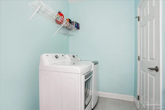 a view of a balcony with a couple of chairs