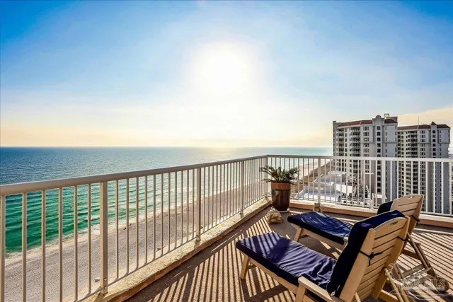 a view of a patio with table and chairs and potted plants