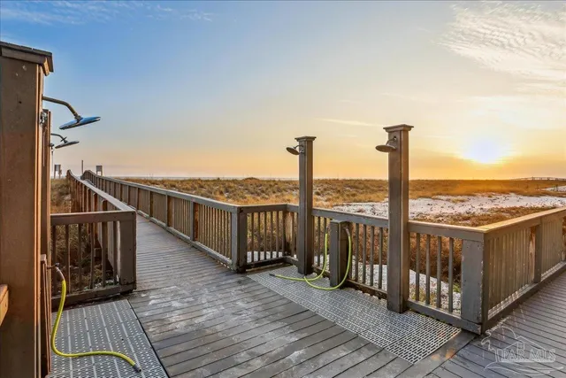 a swimming pool with outdoor seating and yard in back